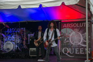 Man playing guitar and singing on stage