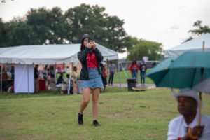 Woman taking photograph at festival