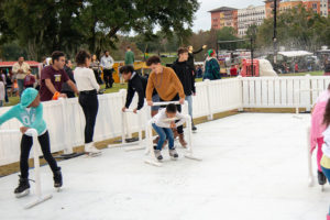 Families ice skating outside