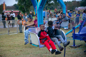 Boys on amusement ride during winter fest