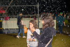 Girls enjoying showflakes during winter fest