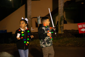 Little girl and boy dressed for Christmas