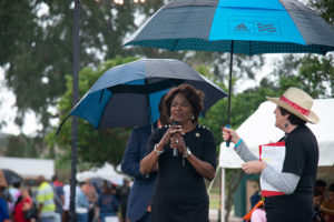 Val Demings speaking at microphone during winter fest
