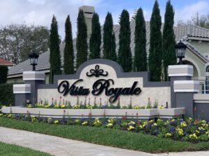 Vista Royale entrance sign with flowers